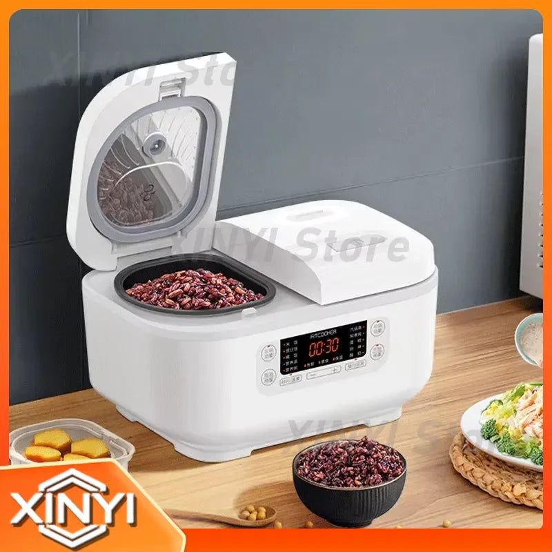 White mini smart rice cooker with open lid and one inner pot filled with food
