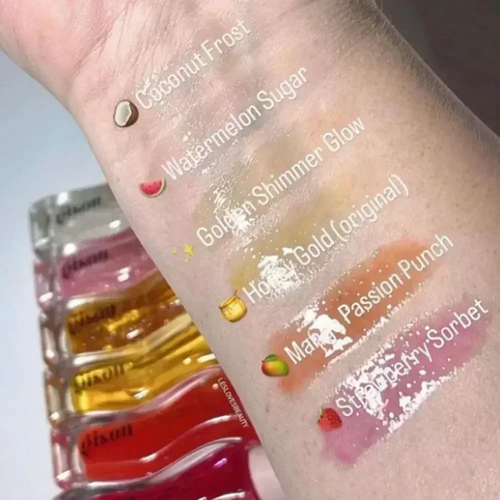 Gisou Honey Infused Lip Oil swatches on arm showing sheer, moisturizing textures in varied colorful fruit shades.