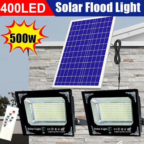 Two-head solar flood light kit with black fixtures, aluminum solar panel, and remote control
