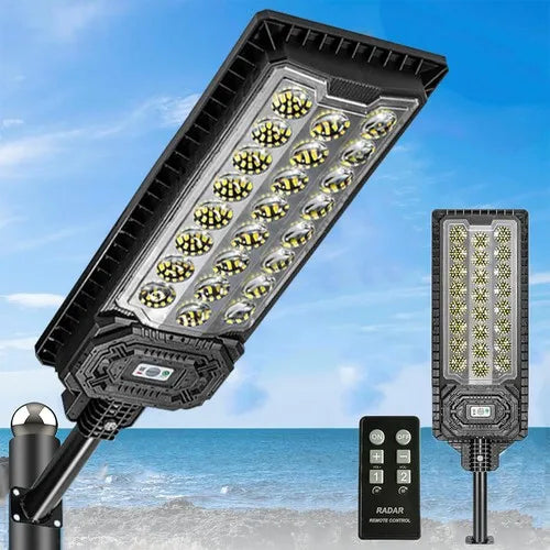 Black solar street light with LED array on adjustable pole-mount flood head