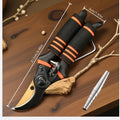 Toughbuilt pruning shears with black-and-orange grips and curved yellow blades