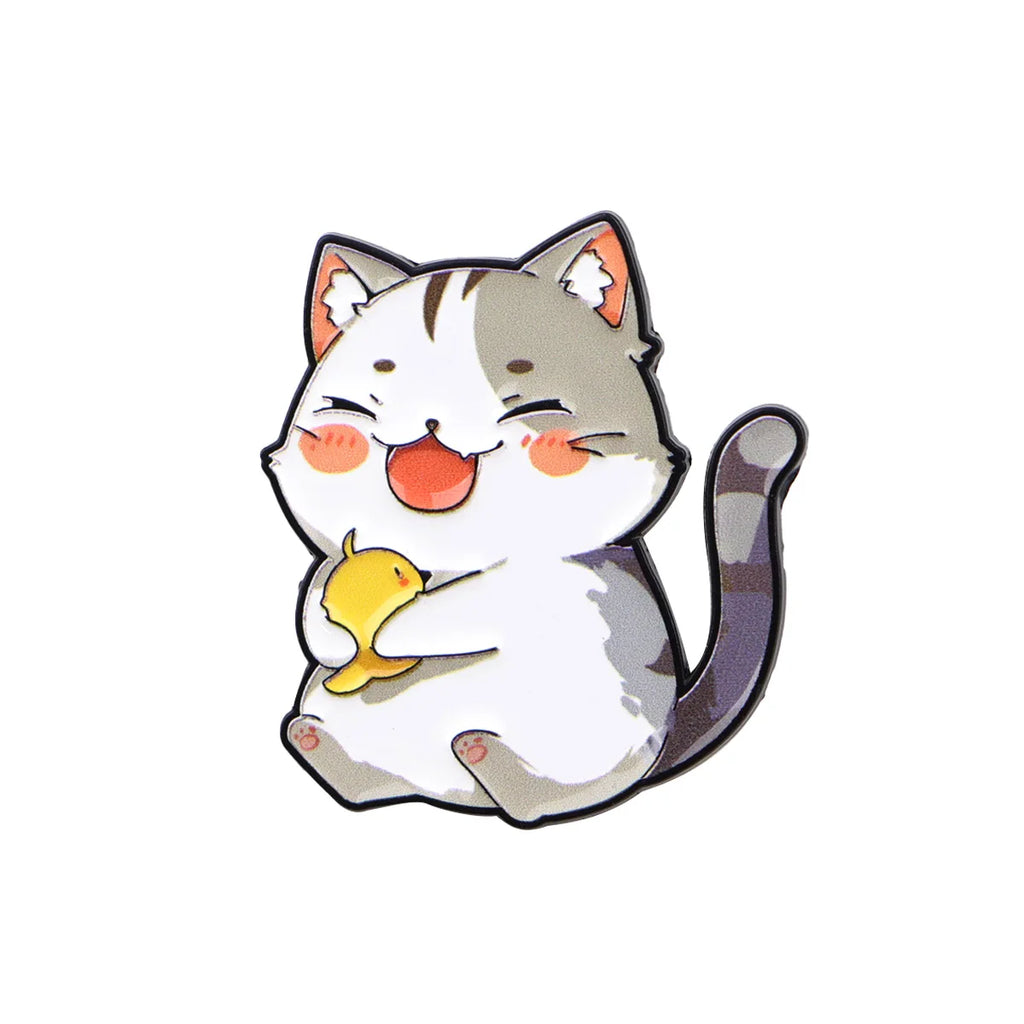Cute grey and white cat enamel pin brooch holding a yellow bird, perfect for backpacks or as a fashion accessory gift.