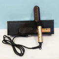 Portable gold and black electric beard straightener comb with heated bristles and cord in retail box.