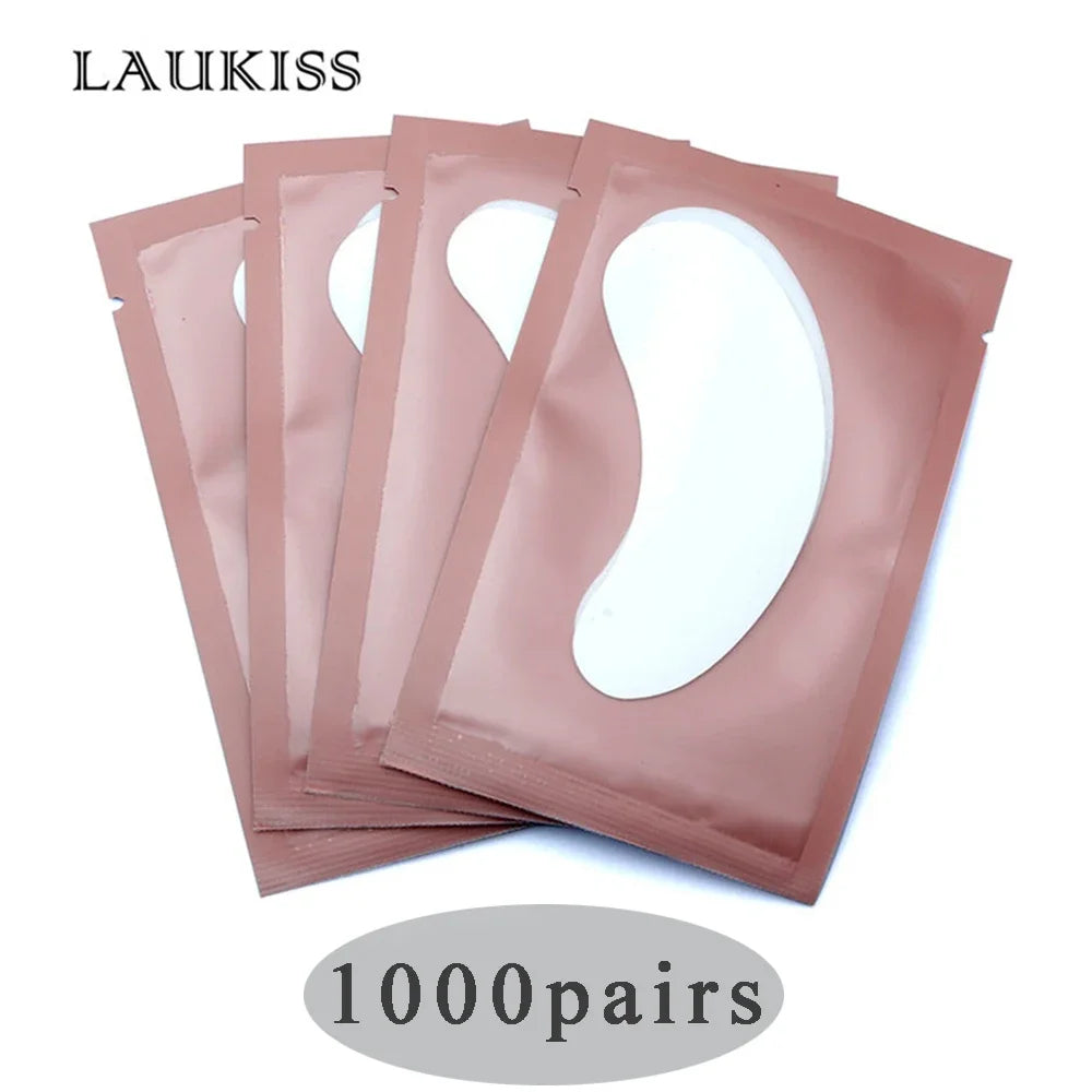 White gel eyelash extension under eye patches in pink metallic packets for professional lash building.