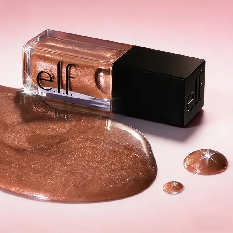 e.l.f. Glow Reviver Lip Oil in bronze shimmer with glossy, moisturizing texture and black cap on pink background.