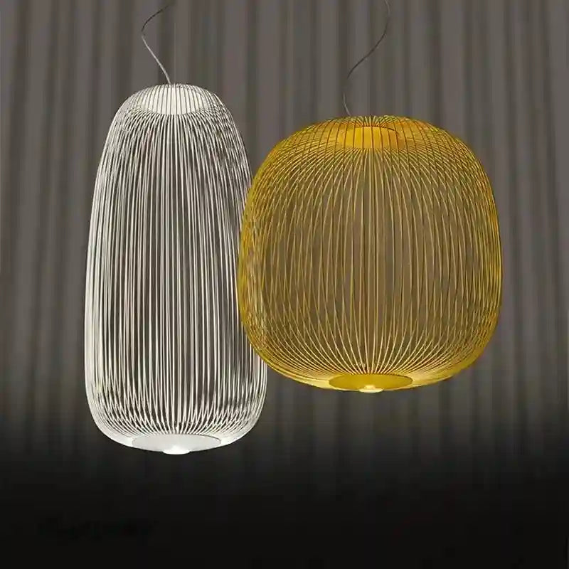 Two modern wire cage pendant lights: one tall white cylinder and one rounded golden orb for decorative interior