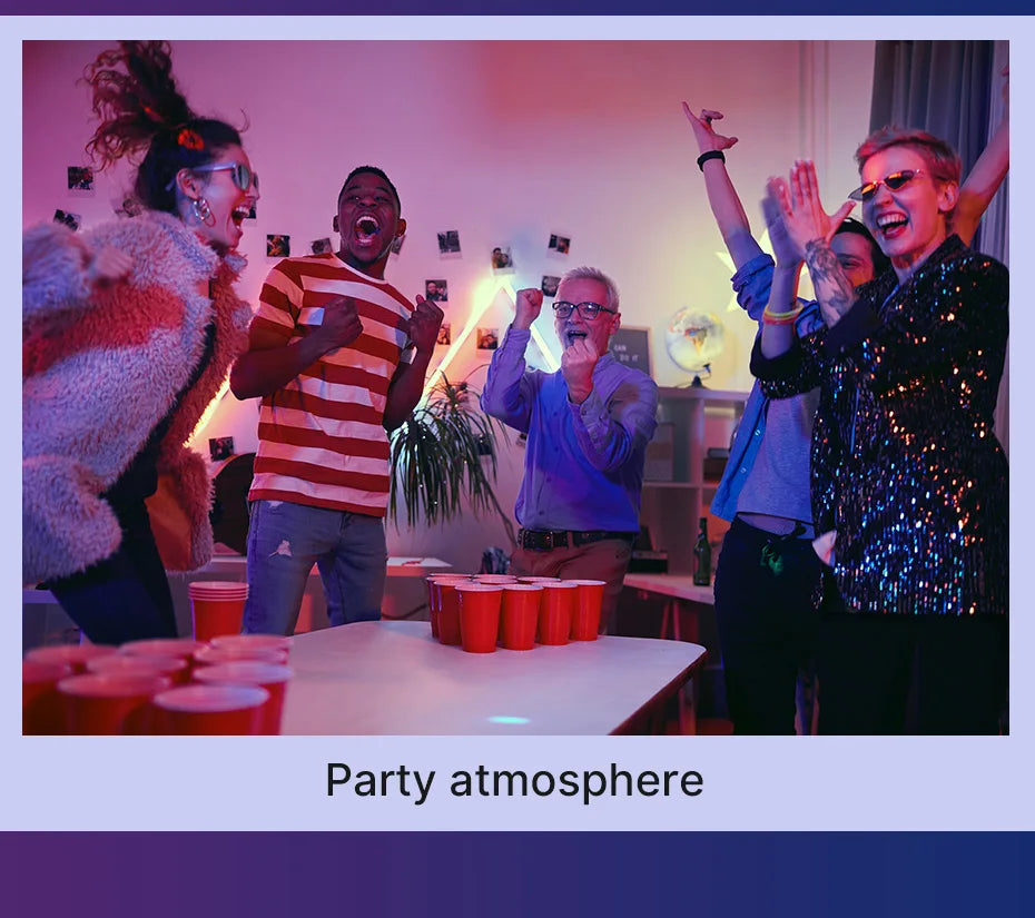 Red plastic solo cups arranged for beer pong on a white table during a group party.