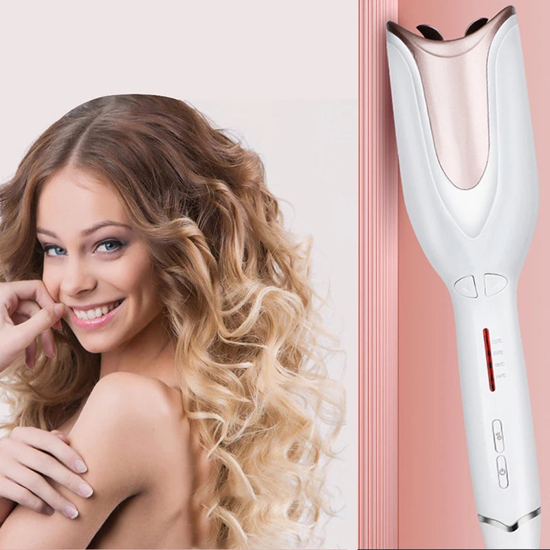 White and rose gold automatic hair curler creating professional curls for a woman with long wavy blonde hair.