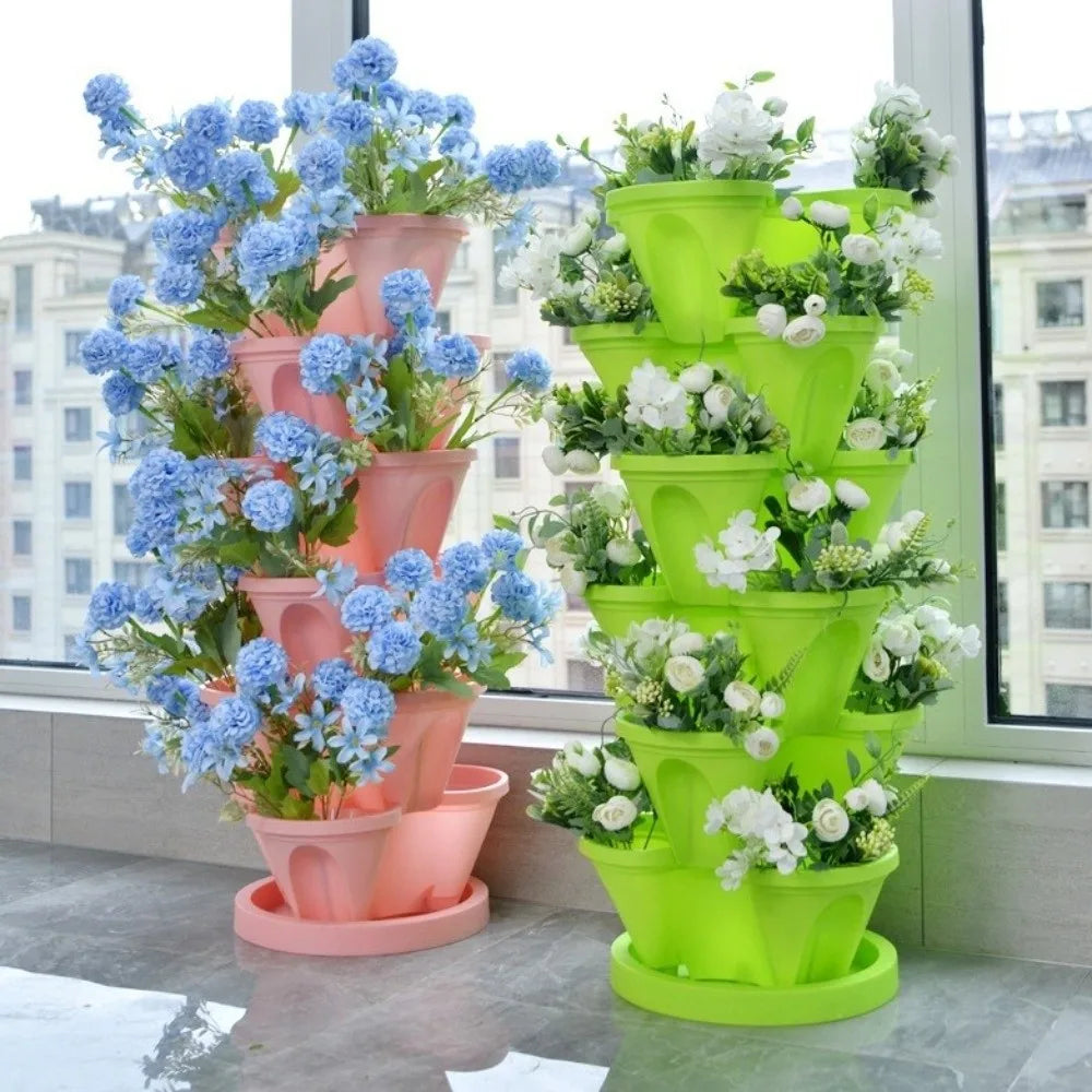 Green tiered stackable plastic planter with central black drainage insert and raised petals