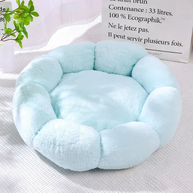 Light blue orthopedic plush pet bed with thick round bolsters and center cushion