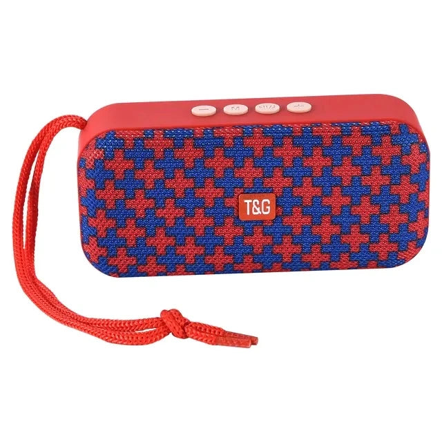 Portable Bluetooth speaker with houndstooth fabric, red top controls, T&G logo