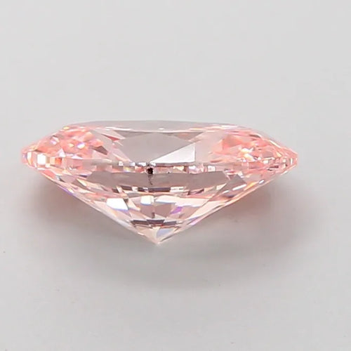 Oval cut pink lab-grown diamond, view of pavilion and bright facets