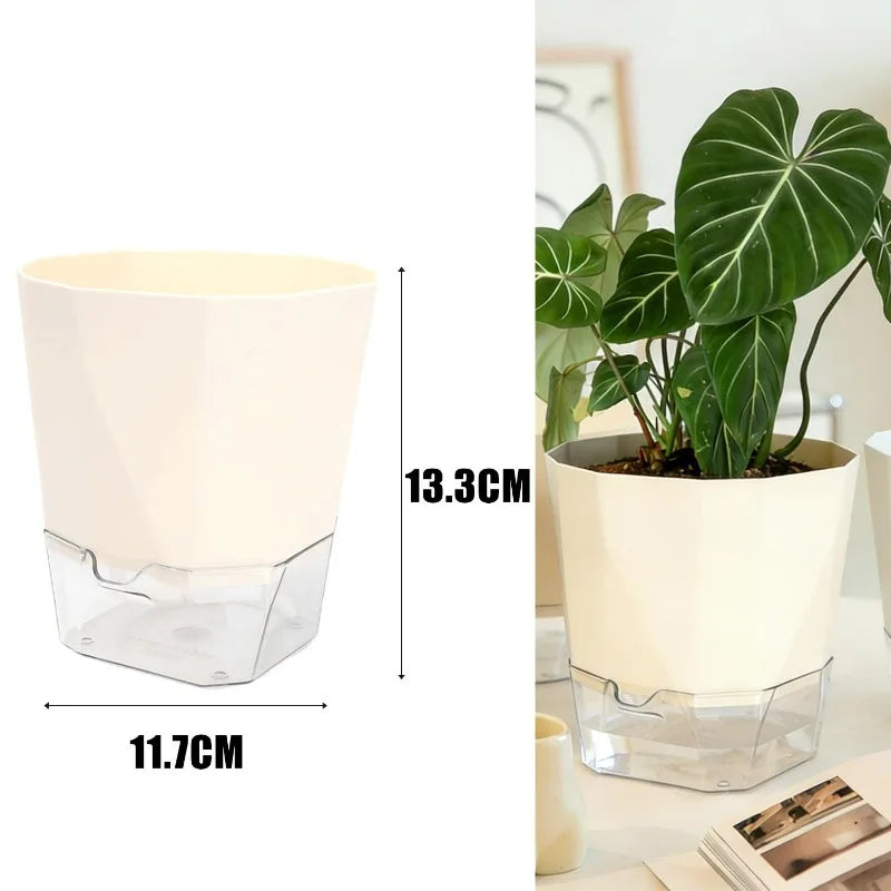Self-watering beige plant pot with clear reservoir base holding leafy plants