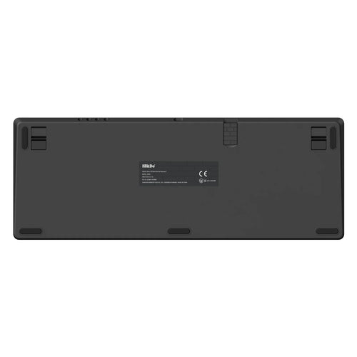 The underside of the black 8BitDo Retro 108 mechanical keyboard, showing adjustable feet and product label information.