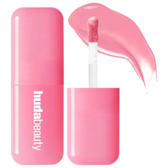 Pink Huda Beauty hydrating lip and cheek tint stick with creamy texture and soft applicator brush for natural rouge.