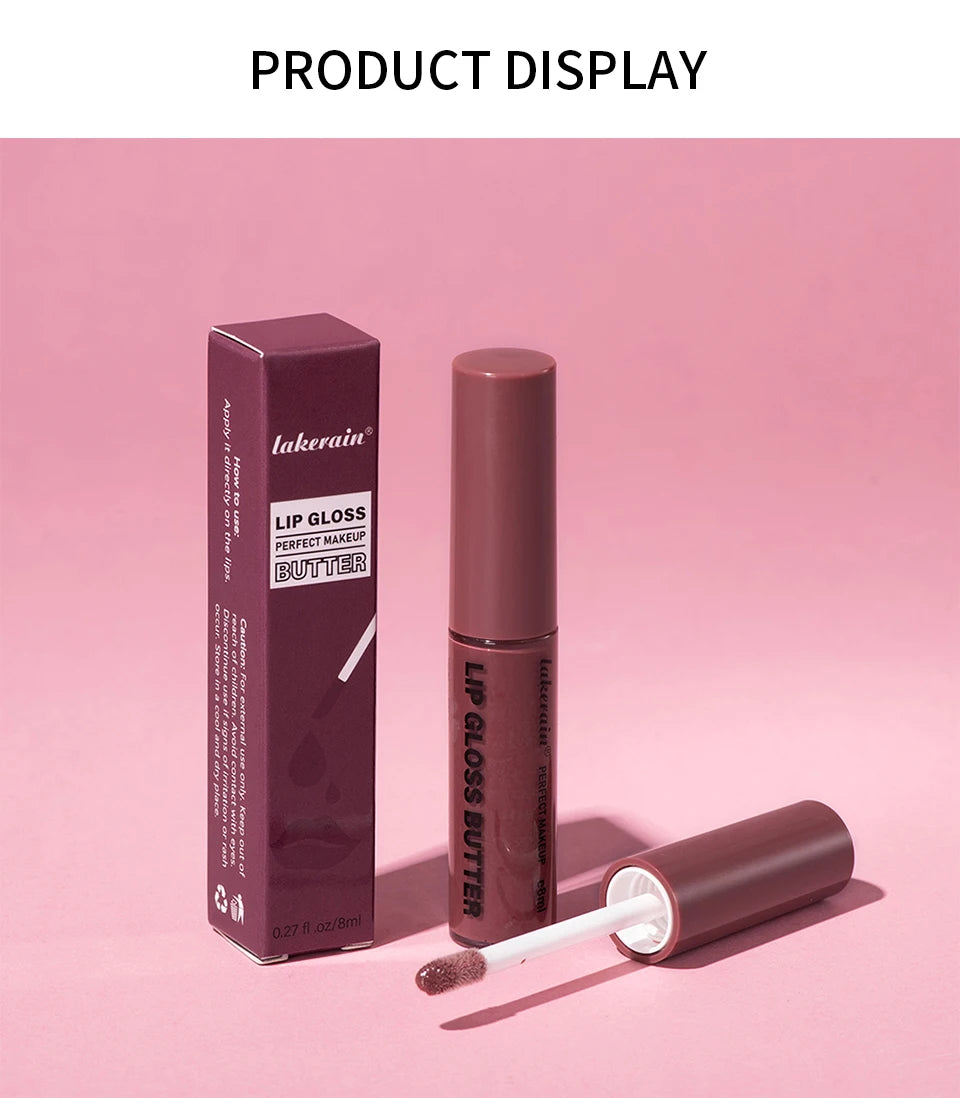 Lakerain non-stick butter lip gloss in dark mauve with applicator brush and matching box on a pink background.