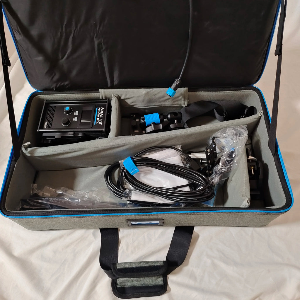 Nanlite PavoSlim 120C LED panel and accessories in a grey padded carrying case with blue trim and black handles.