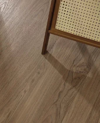 Light brown wood-grain SPC click flooring with plank seams