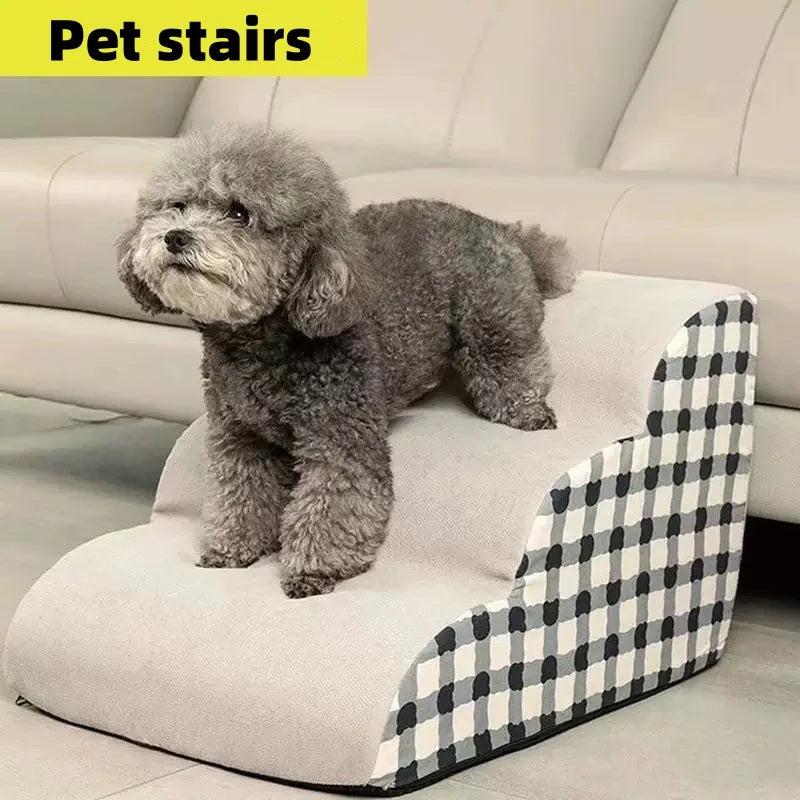 Grey dog on a non-slip memory foam pet staircase for sofa access. Washable, stable 3-step ladder for small pets.