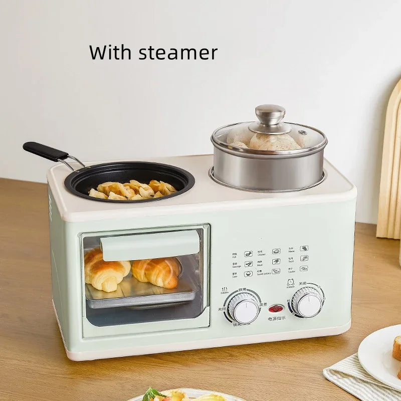 Mini 4-in-1 breakfast machine with steamer lid over pan and oven window pastries