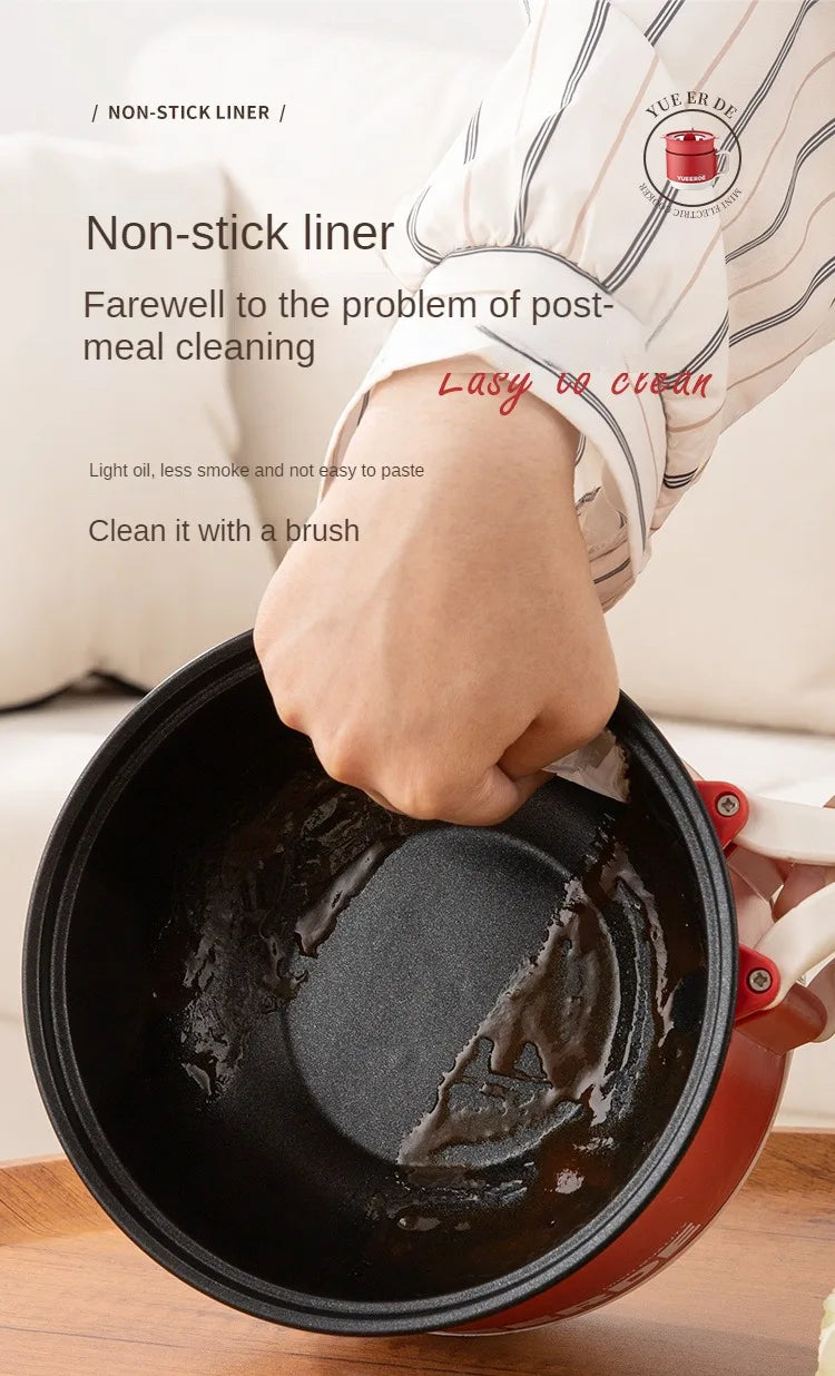 Electric folding non-stick cooking pot with black inner liner and red handles