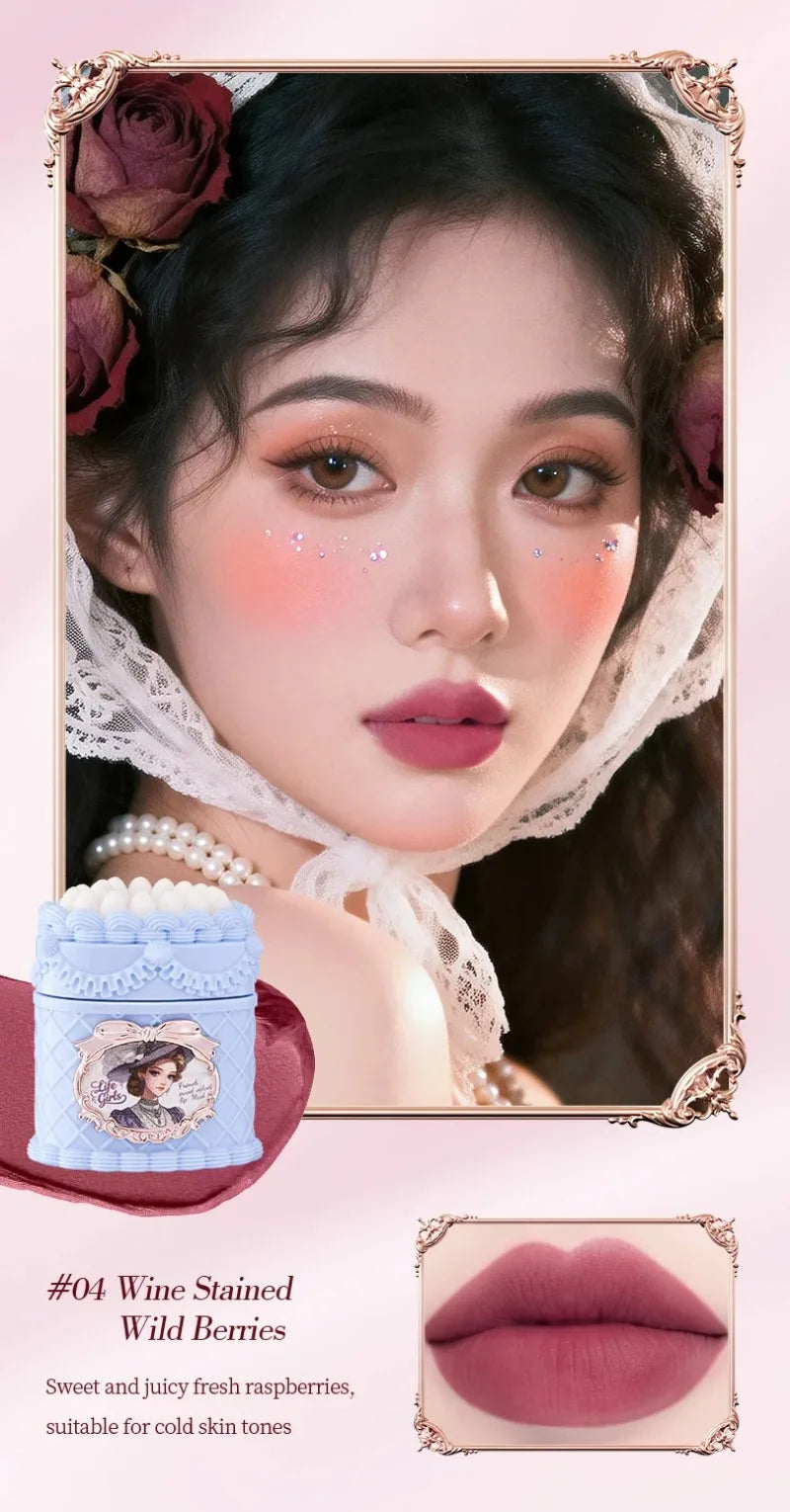 Vintage-style matte velvet lip mud in #04 Wine Stained Wild Berries with a soft-focus, highly pigmented berry finish.