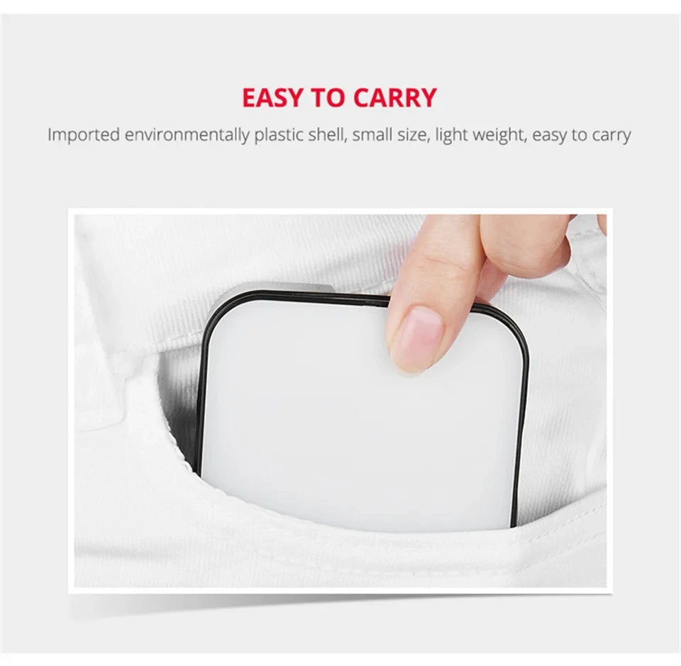Small square light with a white panel and black frame being placed into a pocket for portable use.