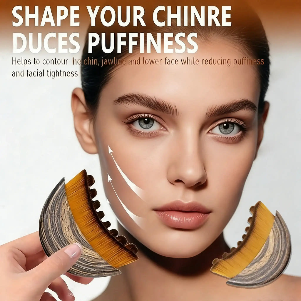 A person uses a curved, wood-grain patterned massage brush with dense, golden-brown bristles on their jawline.