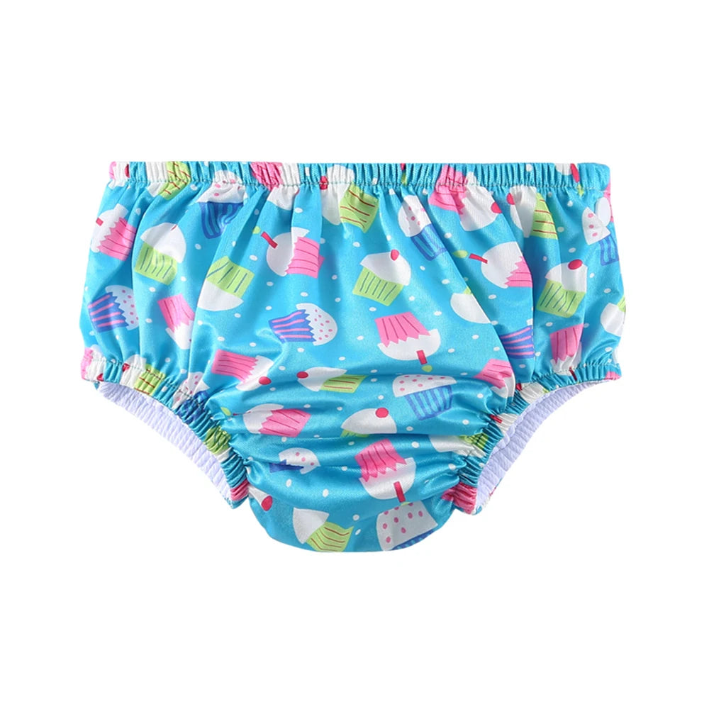 Blue reusable baby swim diaper with colorful cupcake print for swimming and baby care.