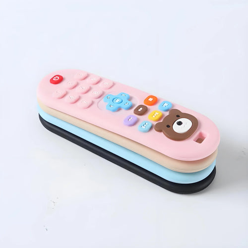 Stack of pink, blue, beige, and black silicone baby teething toy remote controls for pain relief.