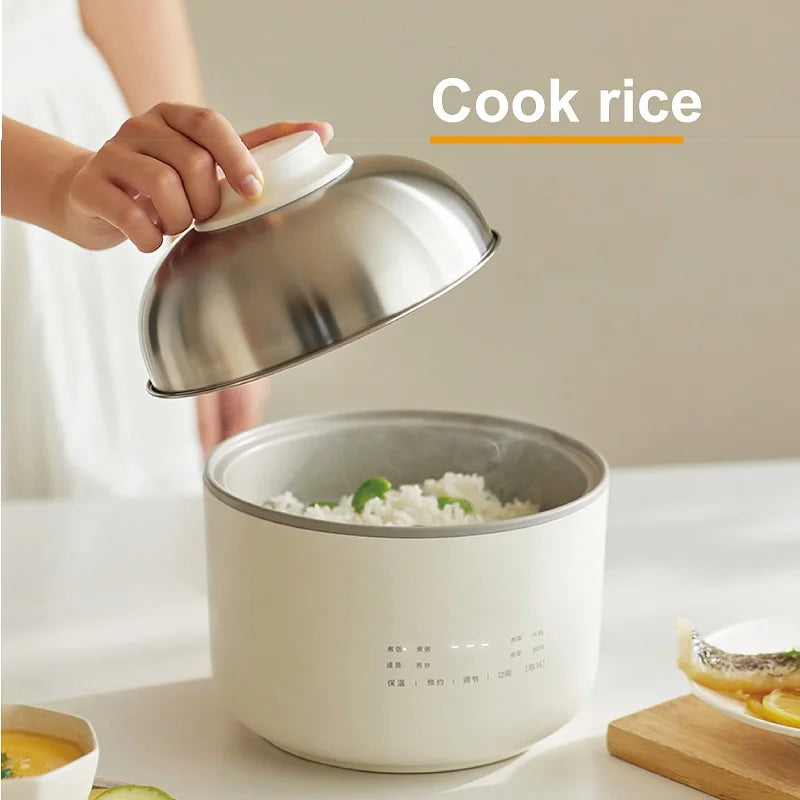 1.5L electric rice cooker with lid removed, bowl of white rice being served