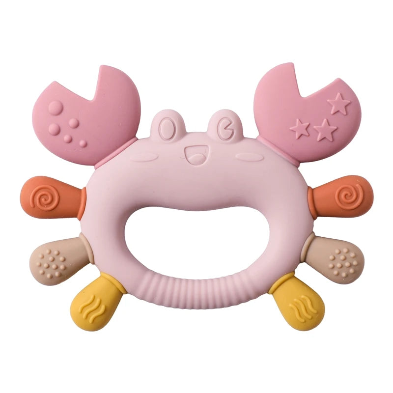 Pink crab baby teething toy made of soft, textured silicone to soothe infant teething pain.