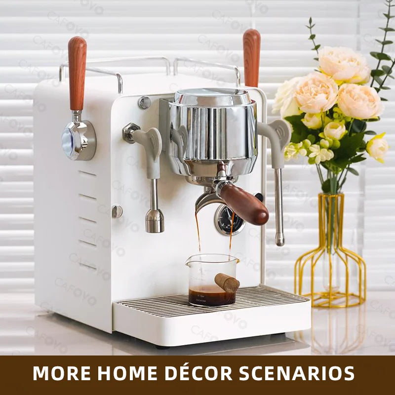 Cafoyo white espresso machine with chrome and wood handles brewing coffee in a modern kitchen setting.