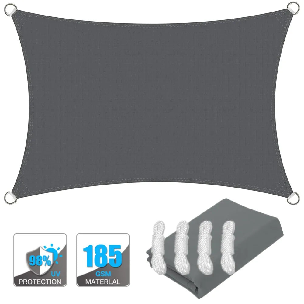 Dark gray rectangle sun shade sail canopy with corner grommets, plus included fabric bundle.