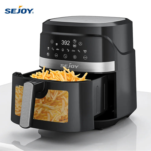 Black air fryer with open basket and visible fries inside