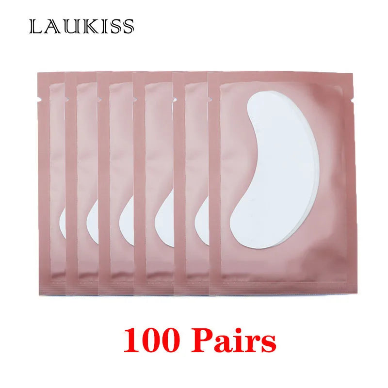 Laukiss lint-free under-eye gel patches in rose gold foil pouches for eyelash extensions and makeup application.