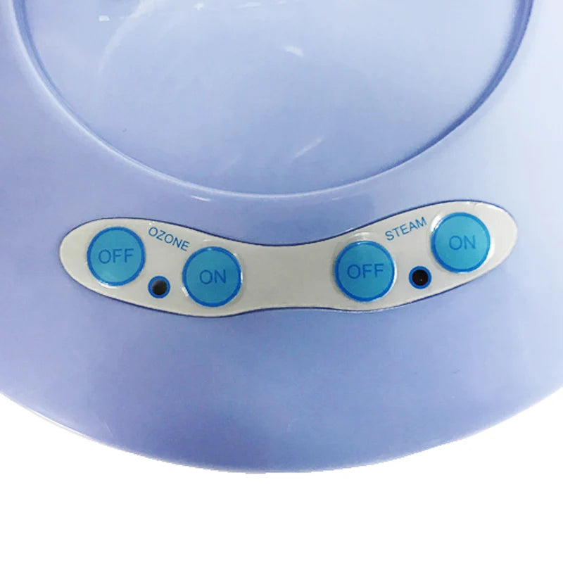 Blue facial thermal steamer control panel with Ozone and Steam power buttons for professional home face care.