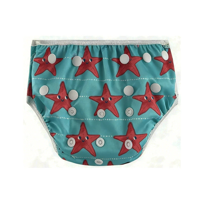 Reusable baby swim diaper in teal with a red starfish pattern and adjustable snap buttons.