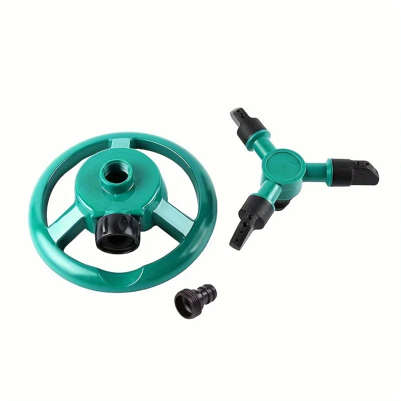 Teal sprinkler body with round wheel base, multiple spray arms, and quick-connect parts.