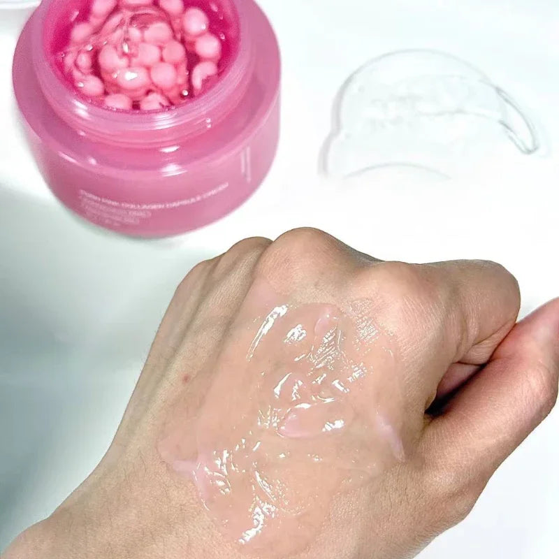 Pink jar of collagen capsule cream and a swatch of the sheer, light pink gel texture applied to the back of a hand.
