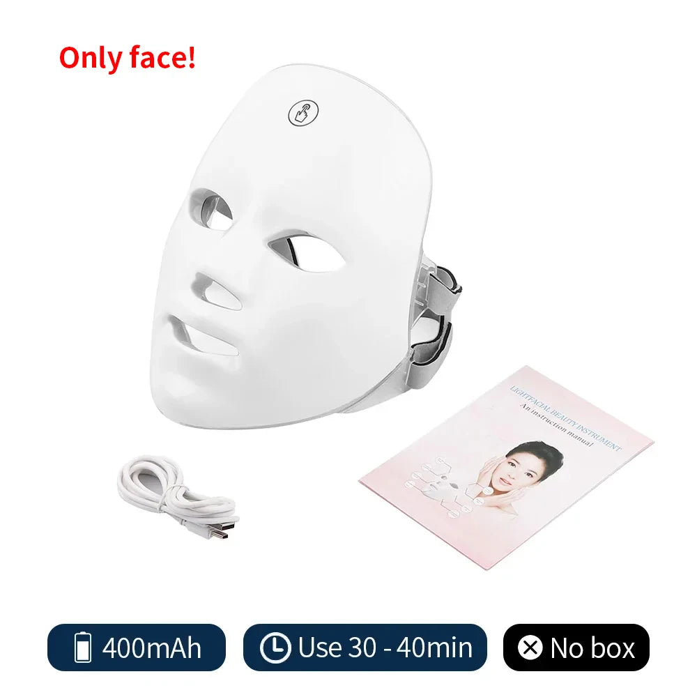 White wireless LED facial mask with adjustable strap, including a charging cable and instruction manual.