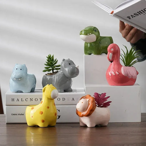 Animal-shaped ceramic plant pot set with colorful animals and small succulents