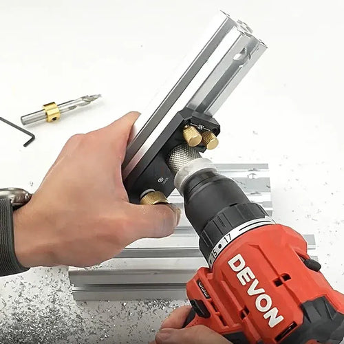 Aluminum profile drilling jig used with a step drill bit and wrench