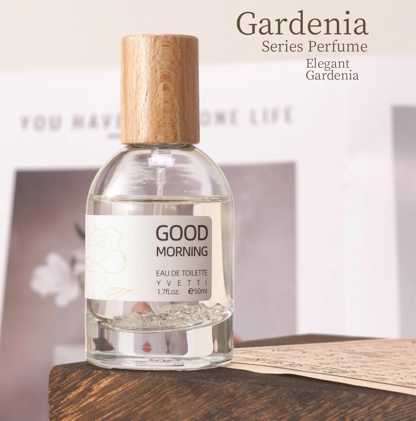 Pure Gardenia niche fresh floral perfume in a clear glass bottle with a minimalist wooden cap and crystal base.