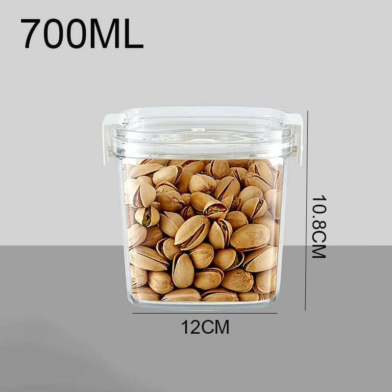 Clear vacuum jar with airtight lid filled with beige pistachios