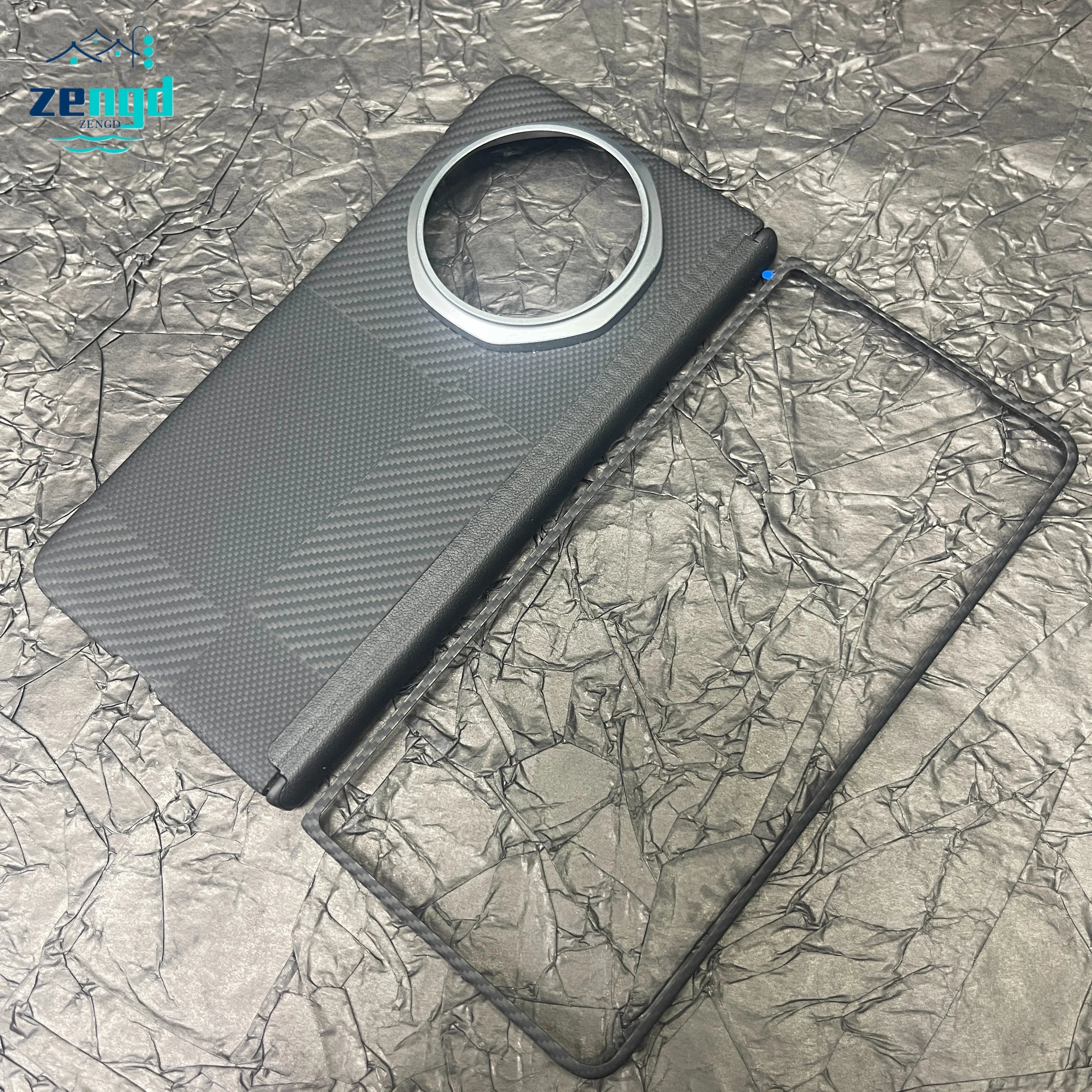 Black carbon-fiber style phone case with a large circular camera cutout and a separate matching rectangular frame.