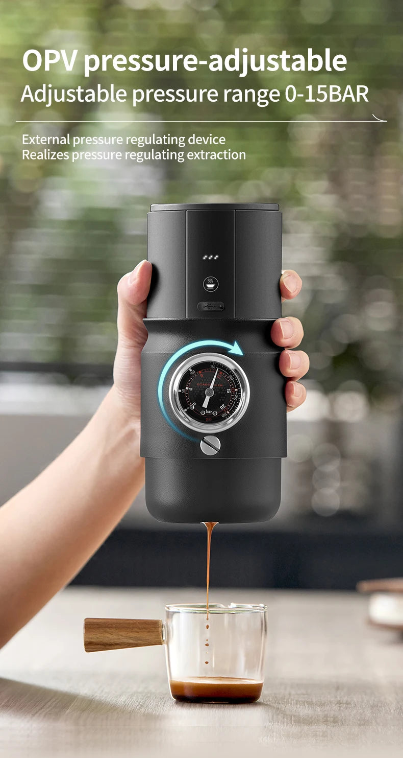 Handheld black portable espresso maker with integrated pressure gauge for 0-15 bar extraction into glass cup.
