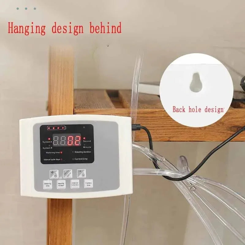 Hanging solar irrigation controller box with clear tubing connected for drip watering