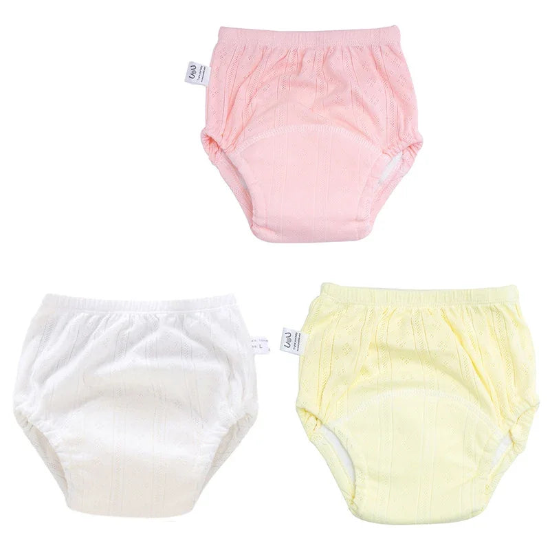 Three-pack of pastel cotton baby potty training diaper pants in size L. Soft, breathable infant underwear.