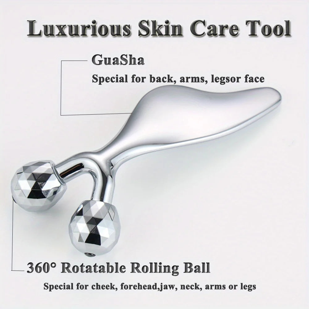 Silver 2-in-1 metal beauty tool featuring a smooth, curved Gua Sha edge and two 360-degree rotating faceted rollers.